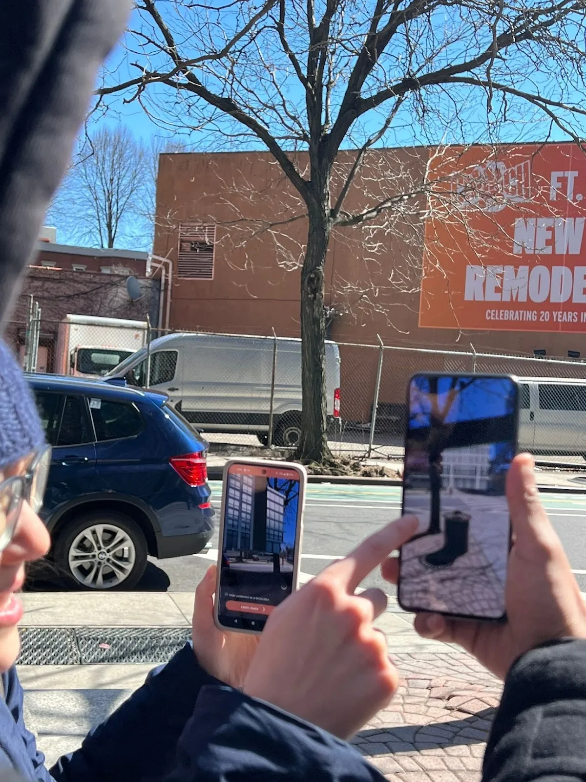 Downtown Brooklyn Tour participants using the inCitu app to visualize a fictional building on the empty lot across the street